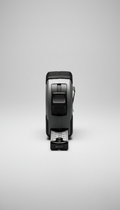 A precision measuring tape is centered on a seamless light grey backdrop, captured with a 50mm lens. The lighting is soft...